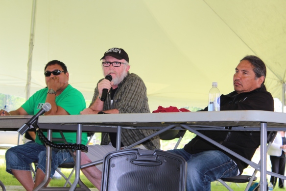 Dr. John O'Connor (centre) speaks about health impacts of oilsands development on a panel with Mikisew Cree member George Poitras (left) and Athabasca Chipewyan First Nation Chief Allan Adam (right)